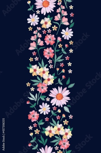 Vertical seamless border with embroidery flowers and leafs. Beautiful vector pattern. © Happy Dragon