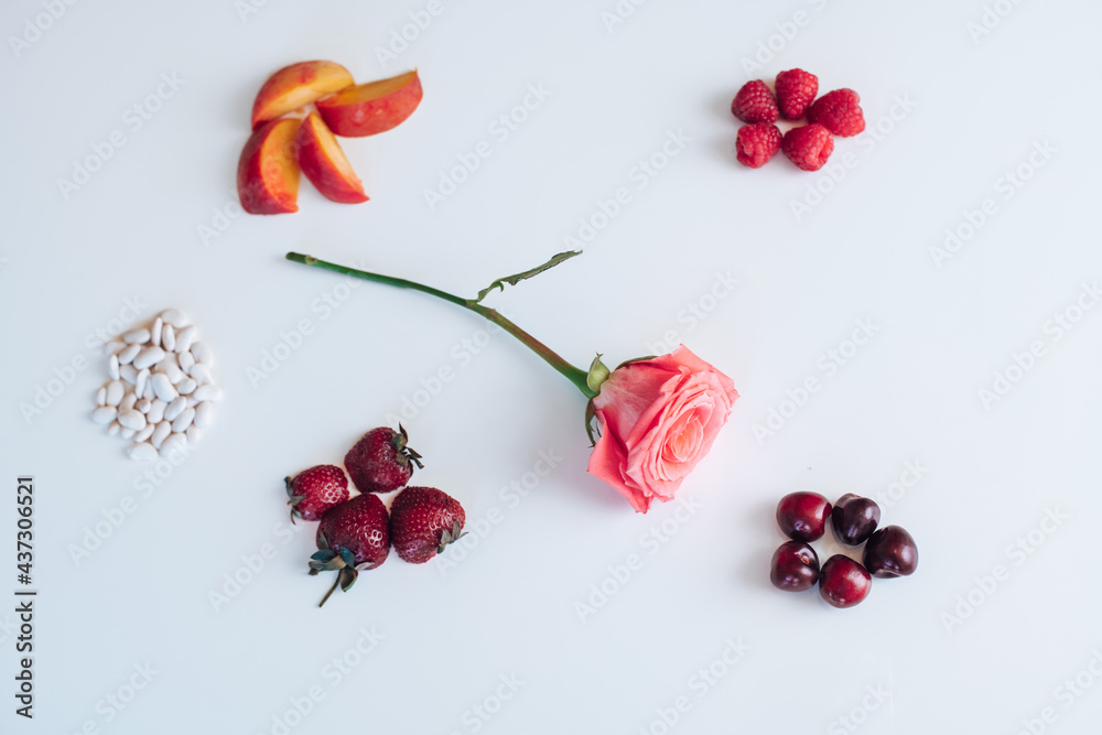 cherry, peach, raspberry, strawberry on white background