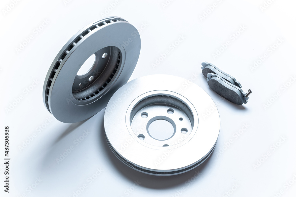 Automotive parts. New metal car part. Auto motor mechanic spare or automotive piece isolated on white background. Technology of mechanical gear with space for text. Automotive parts. New metal car part. Auto motor mechanic spare or automotive piece isolated on white background. Technology of mechanical gear with space for text.