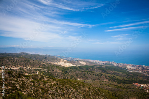 Benalmádena teleferico shot from the top of Calamorro with city and coastline in the background. Andalusia, Spain.