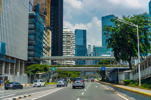 Jakarta city landscape with moderate traffic during the day. Vibrant and futuristic city