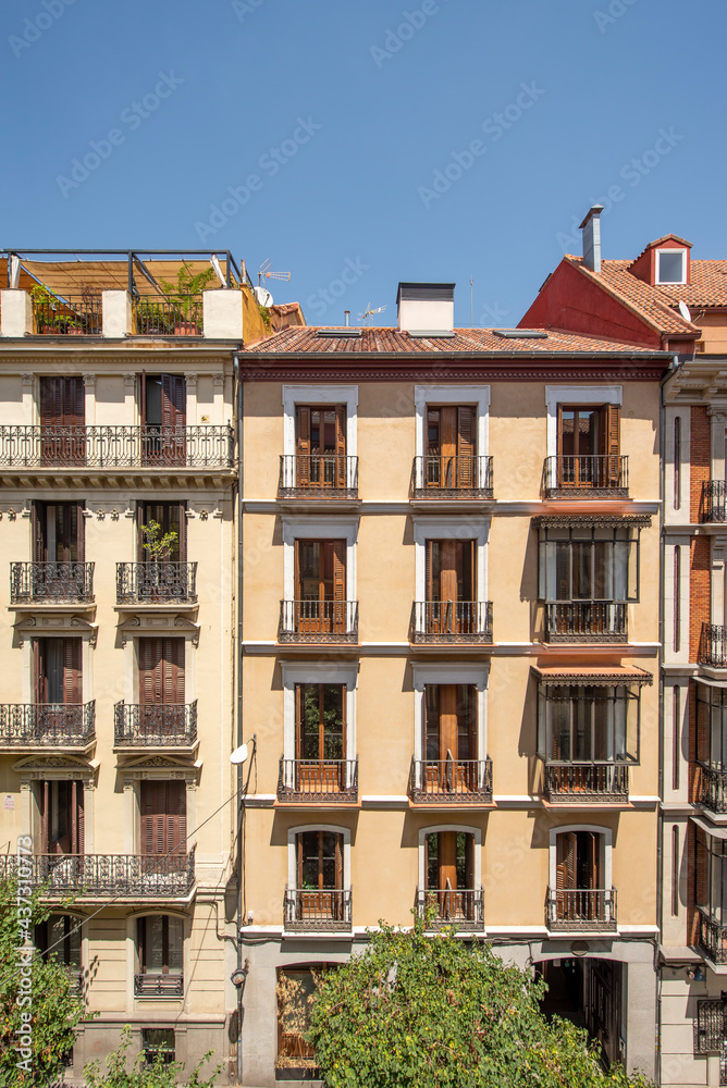 Facades of characteristic houses in the center of Madrid on a sunny spring day