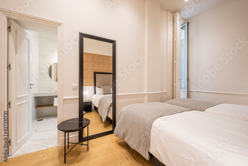 Room for two people with two beds, full-length mirror and en-suite bathroom © Toyakisfoto.photos