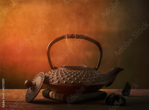 teapot on a table in a zen temple with smoke coming out
