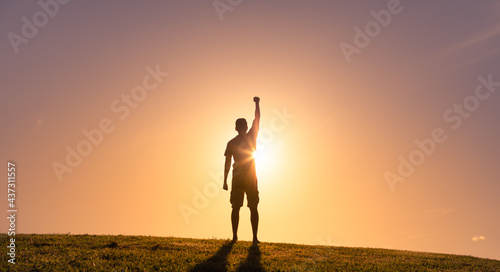 Obraz na plátne Strong determined woman with fist up to the sky