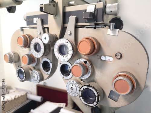 Closeup vintage ophthalmic microscope or Phoropter, Optical equipment for testing vision. Professional medical machine. Ophthalmology and Optometry.