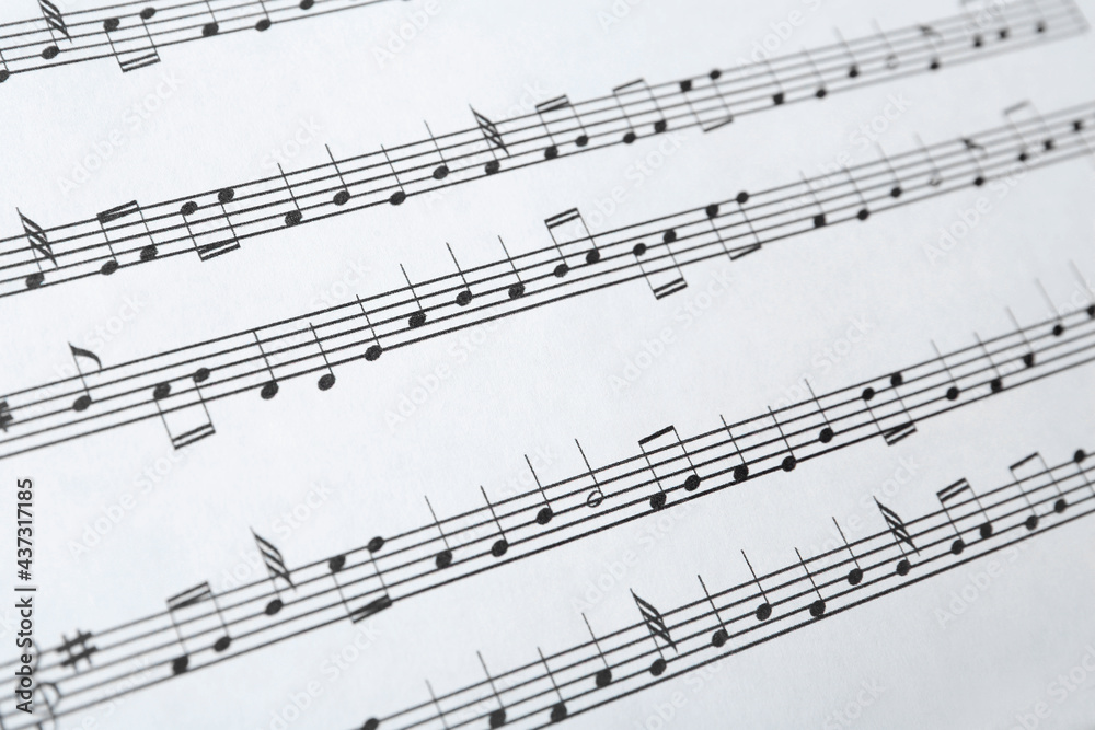 Paper sheet with musical notes, closeup view Paper sheet with musical notes, closeup view