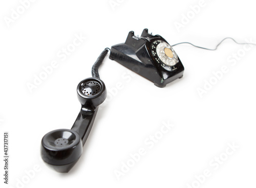 фотографія Old Late 60s - 70s style black telephone with rotary dial