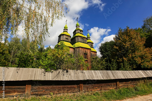 Ancient wooden Church of the Holy Great Martyr Paraskeva in Pyrogiv, Ukraine. September 2012 photo