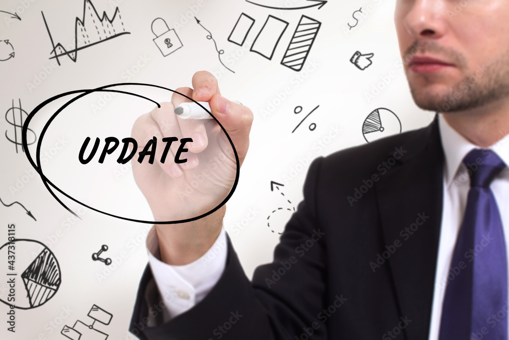 Business, technology, internet and network concept. Young businessman thinks over the steps for successful growth: Update Business, technology, internet and network concept. Young businessman thinks over the steps for successful growth: Update