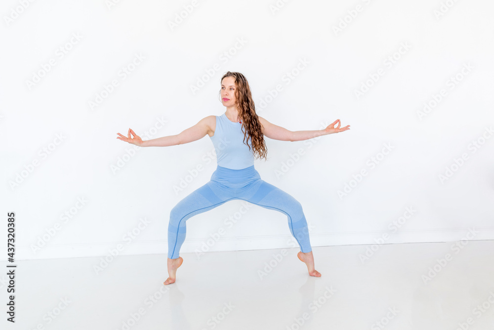 Young diverse woman doing yoga stands on tips her feet. Exit to nirvana and meditation. Young diverse woman doing yoga stands on tips her feet. Exit to nirvana and meditation.