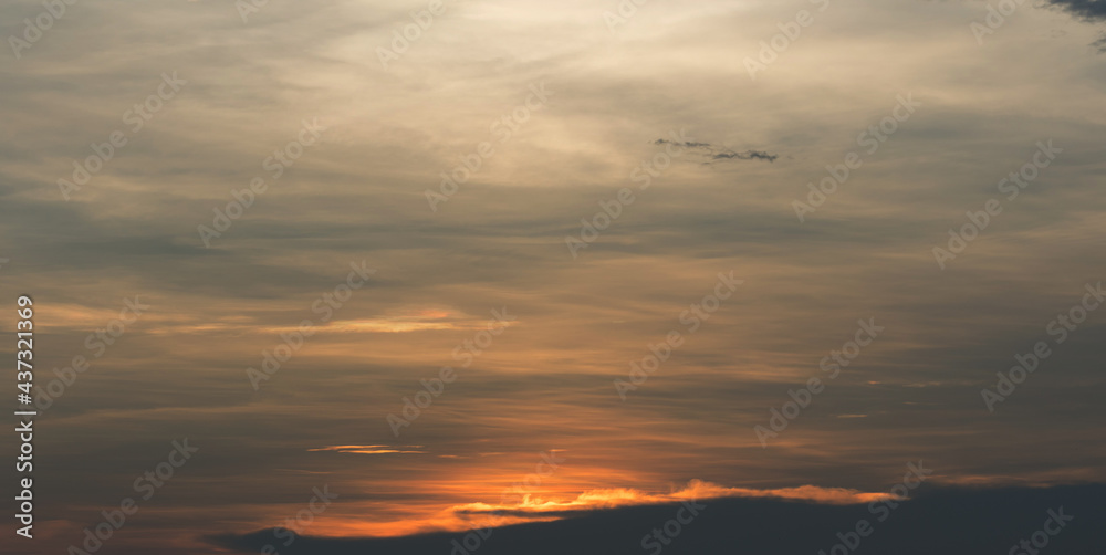 Beautiful sunset sky above clouds with dramatic light