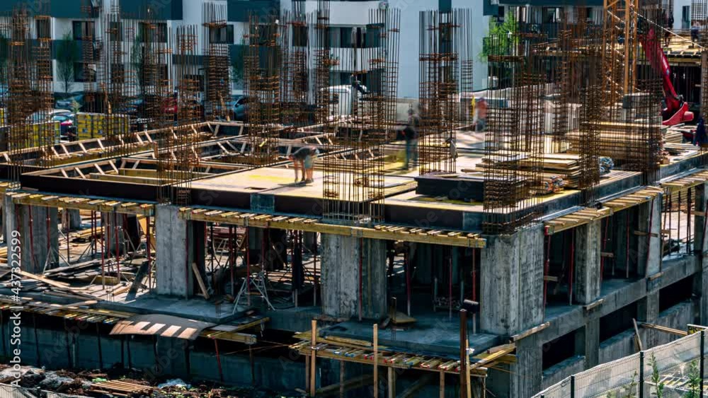 Time lapse construction site of residential buildings. Workers work at construction site reinforced concrete structure Time lapse construction site of residential buildings. Workers work at construction site reinforced concrete structure
