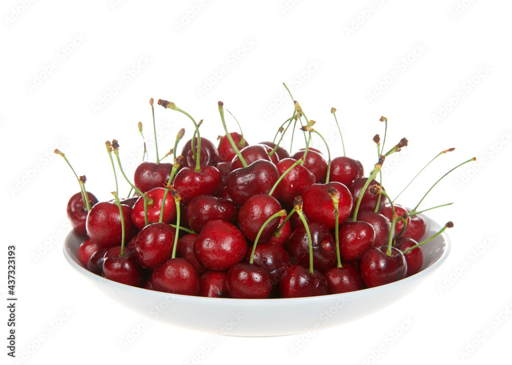 Close up of one porcelain bowl filled with fresh organic Bing Cherries with stems isolated on a white background. Close up of one porcelain bowl filled with fresh organic Bing Cherries with stems isolated on a white background.