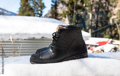 black boots on fresh snow.