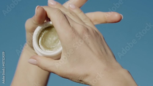 Wallpaper Mural nature cosmetics, female hands hold a tube of cream outdoors Torontodigital.ca