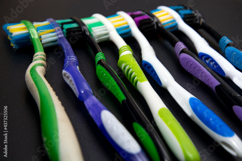 Toothbrushes on a black background.
