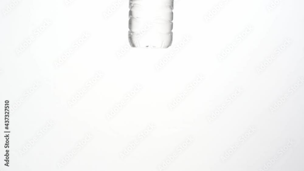 Close up of clean and clear plastic drinking water bottle isolated on white background in 4K footage. Close up of clean and clear plastic drinking water bottle isolated on white background in 4K footage.