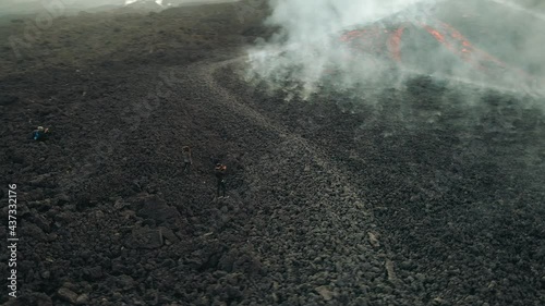 People at Pacaya volcano hike after big eruption in Guatemala. Drone aerial photo