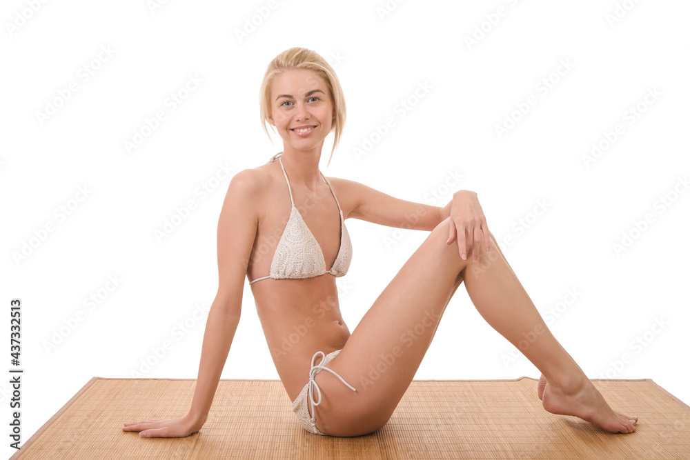 Obraz premium young slender woman in white swimsuit