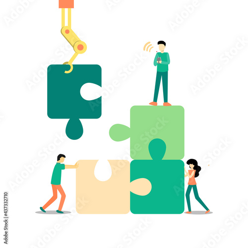 Man using a remote controling jigsaw to assemble other pieces.  his temmates working together to complete this puzzle. Teamwork with technology concept