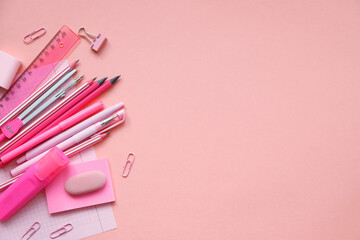 Stationary concept, Flat Lay top view Photo of school supplies scissors, pencils, paper clips,calculator,sticky note,stapler and notepad in pastel tone on pink background with copy space, flat lay.