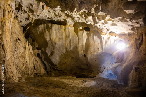 Inside view of Karain Cave in Antalya, with natural stalactites and stalagmites around in Turkey photo