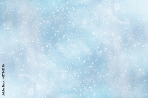 blue snowfall bokeh background, abstract snowflake background on blurred abstract blue © kichigin19