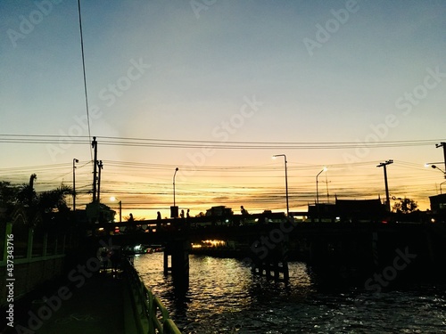 Bridge walking path cross Khlong Saen Saeb on night time, main canal transport in Bangkok, Sunset scene