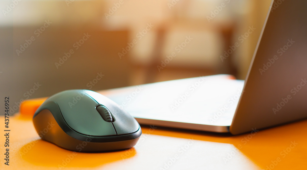 Sunlight - Mouse, Notebook or laptop on desk at home for working or communication with employee or worker or customer via online internet network on computer Sunlight - Mouse, Notebook or laptop on desk at home for working or communication with employee or worker or customer via online internet network on computer