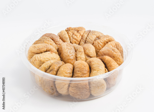 dried figs in round package isolated white background
