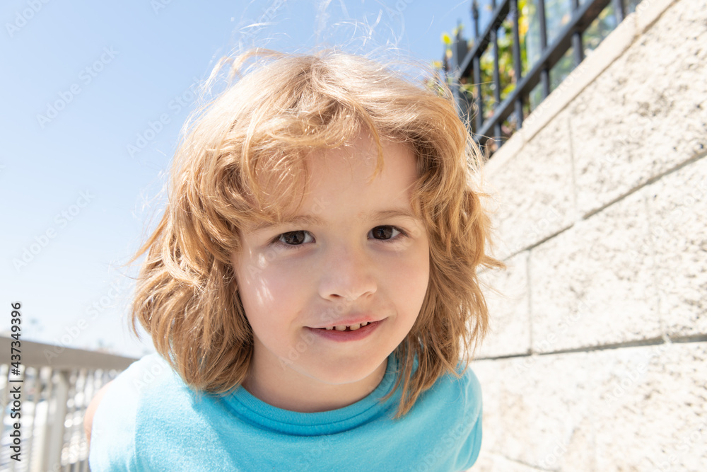 Portrait of happy boy child smiling summer outdoors, face Portrait of happy boy child smiling summer outdoors, face