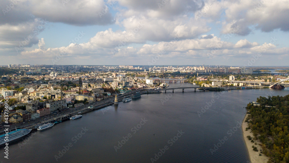Aerial view of Kyiv city and Dnieper river. Podil historical district skyline from above. Panorama of the capital of Ukraine