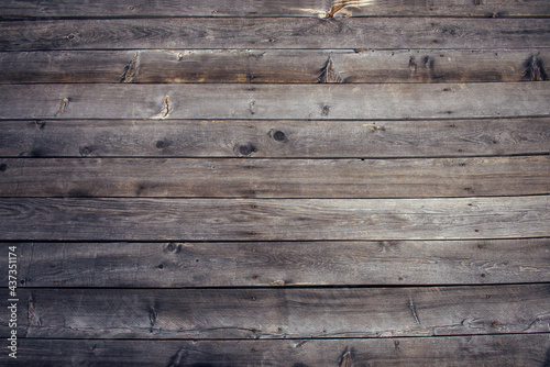 Exposed hardwood planking. Old wooden background, dilapidated horizontal boards, close-up.