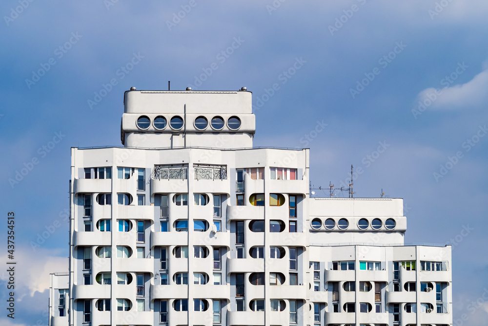Residential building. Tenement against blue sky. Residential building. Tenement against blue sky.