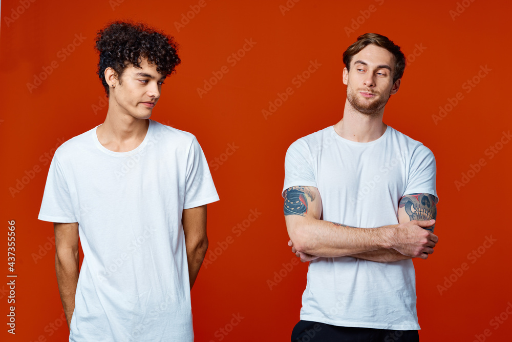 Two friends t-shirts communicating isolated background fun Two friends t-shirts communicating isolated background fun