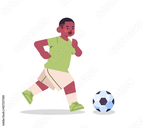 Fototapeta Naklejka Na Ścianę i Meble -  little african american boy playing football healthy lifestyle childhood concept full length