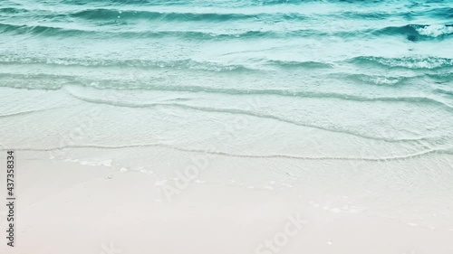 Top view of clean white beach and sea waves crashing on the beach and blank space for Traveling, Relaxation, Freshness, Vacation, Holiday and Summer concept background
