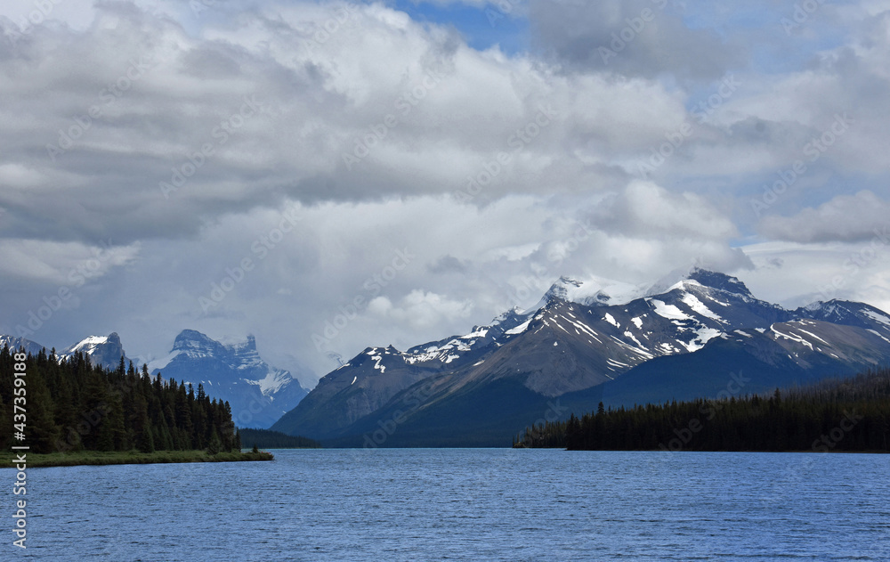 maligne lake and snow-capped mountain peaks in summer in jasper national park,  alberta, canada