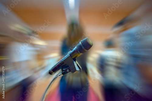 Close-up of retro microphone at concert or meeting conference hall