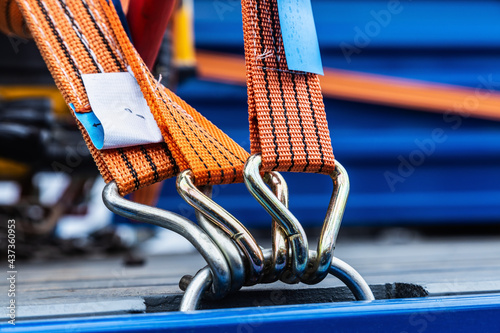 Slika na platnu cargo is held by tension safety belts with mechanical locks