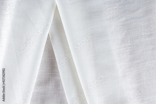 draped surface of linen white fabric, background