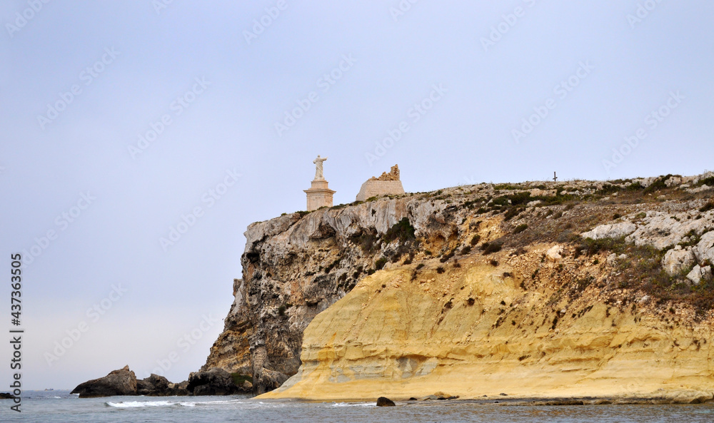 View of St Paul's Island and St Paul's Monument on the Rocks from a boat off the coast of Malta, Europe
