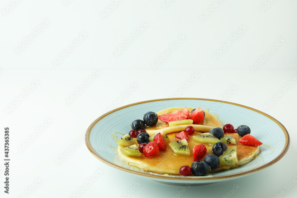 Concept of delicious dessert with pancakes on white background Concept of delicious dessert with pancakes on white background