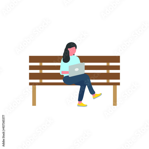 woman sitting on park bench with laptop