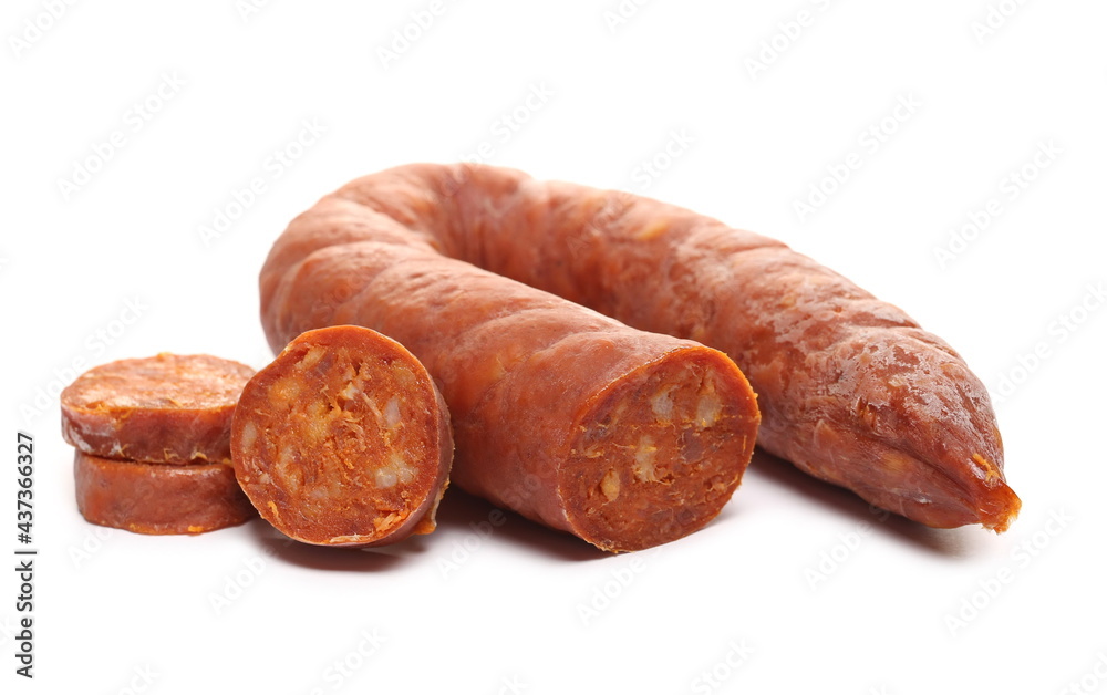 Fermented semi-hard dried spicy sausage slices, pig meat isolated on white background Fermented semi-hard dried spicy sausage slices, pig meat isolated on white background