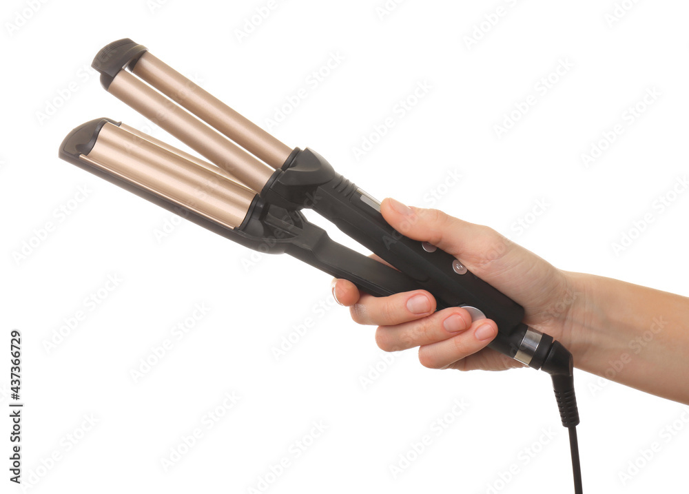 Obraz premium Woman holding modern triple curling iron on white background, closeup