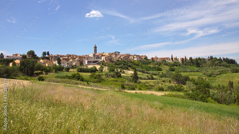 landscape with the village of peccioli in tuscany