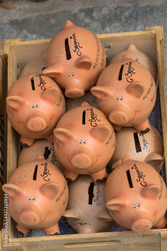 View of several handmade clay pigs, traditional in Segovia, for sale in a market photo