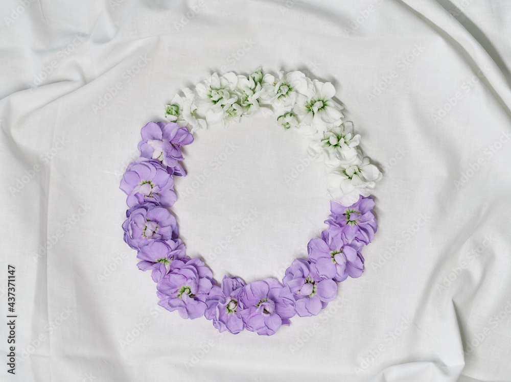 Spring flowers aesthetics. Decorated purple hydrangea and white flowers circle composition isolated on white cloth. Copy space for text. Floral, botanical or valentines day concept. High quality photo Spring flowers aesthetics. Decorated purple hydrangea and white flowers circle composition isolated on white cloth. Copy space for text. Floral, botanical or valentines day concept. High quality photo